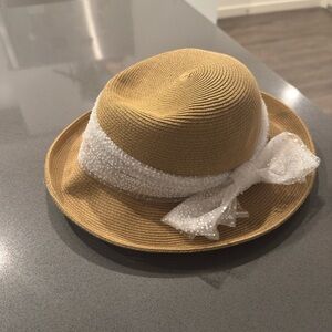 Elegant Tan Women’s Sun Hat with White Bow